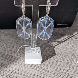 Natalie Mills Audra earrings, featuring a blue pave set cubic zirconia cross des